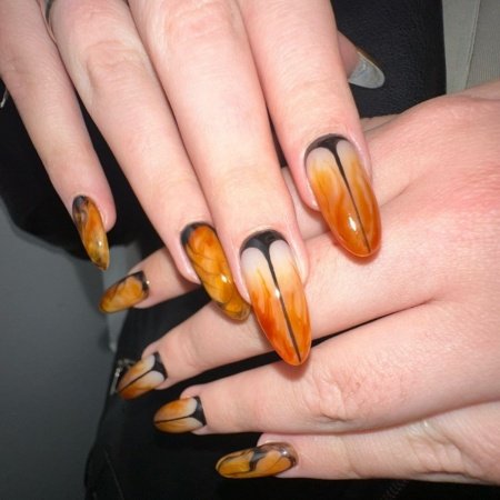 15+ Gorgeous Orange Nail Art Ideas to Inspire Your Next Manicure 8 Orange and Black Marble Nails