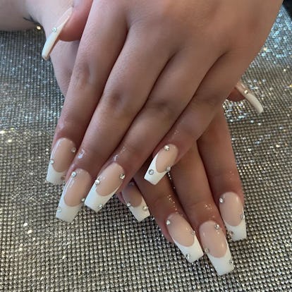 Add rhinestone accents to your coffin-shaped French manicure.