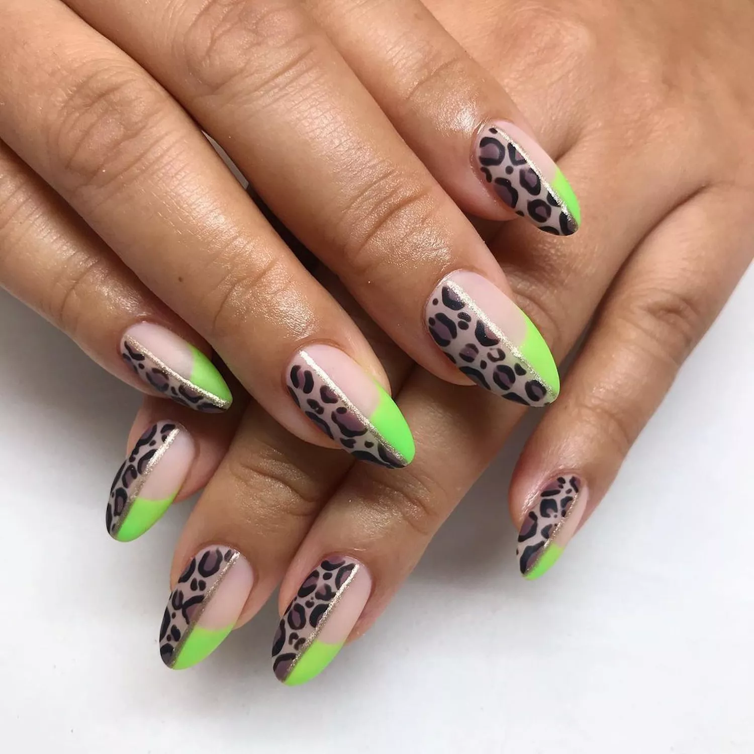 Cheetah print nails with neon green French tip