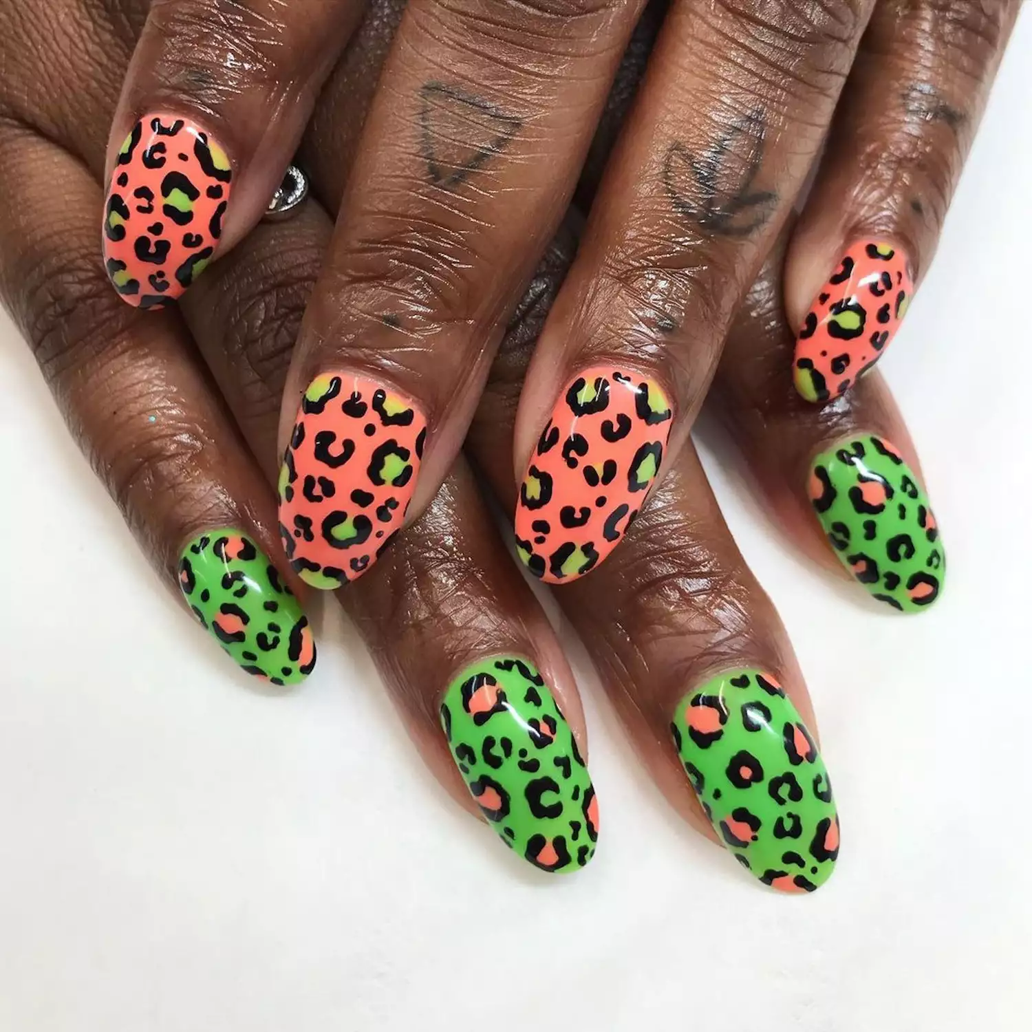 Peach and lime green cheetah print nails