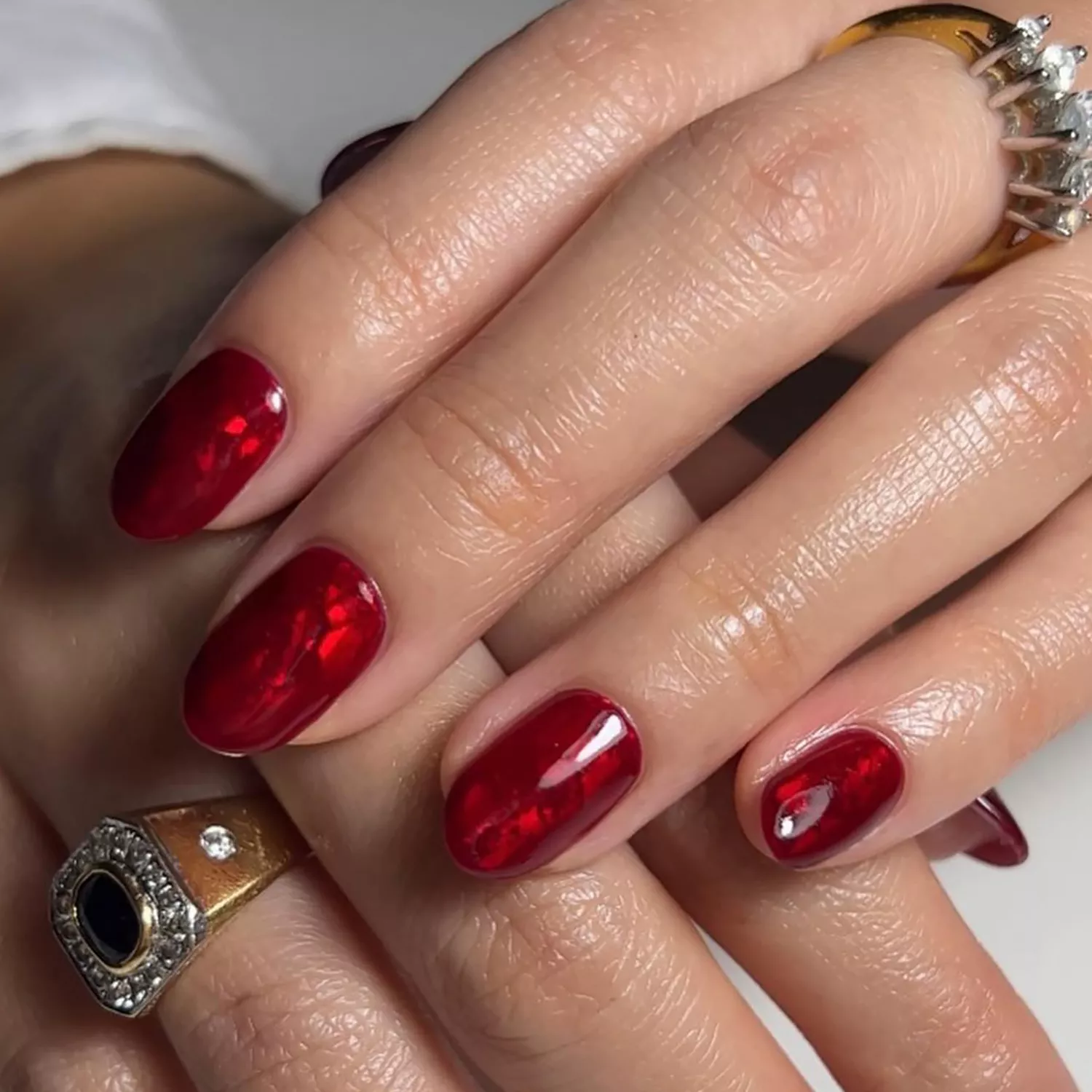 55+ Winter Nail Design Ideas 2025 21 A shimmery red foil manicure