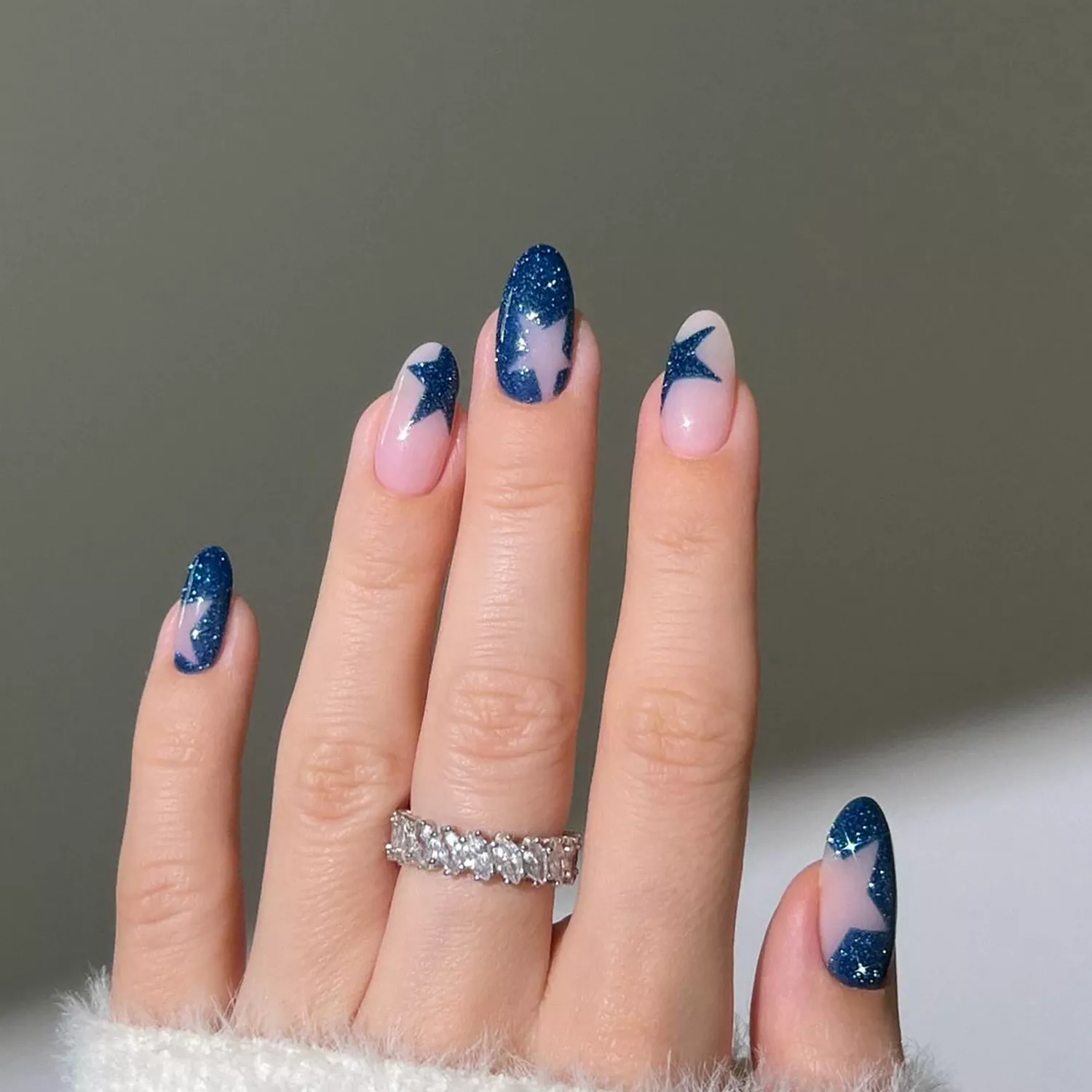 55+ Winter Nail Design Ideas 2025 23 A shimmery blue velvet manicure with star cutouts