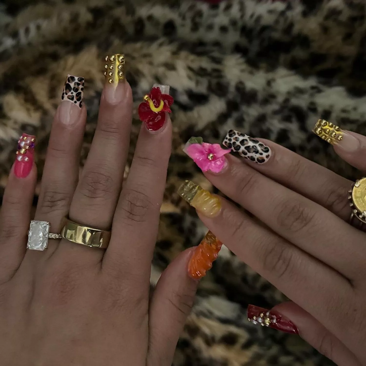 Intricate mismatched manicure with cheetah accent nails