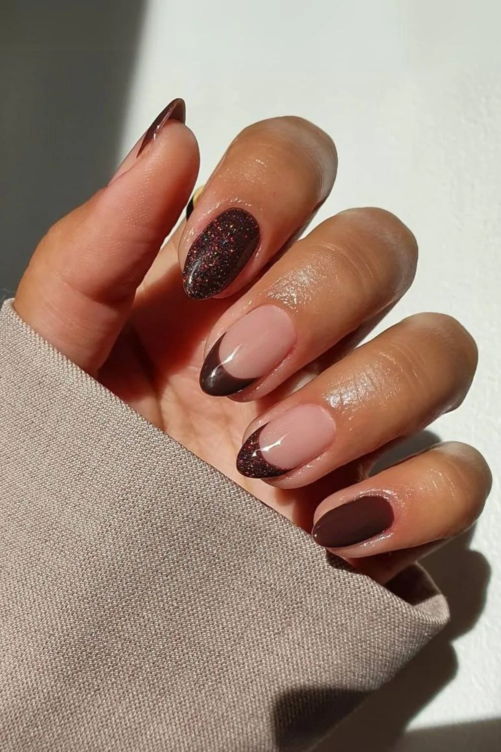 Shimmery brown French tip nails