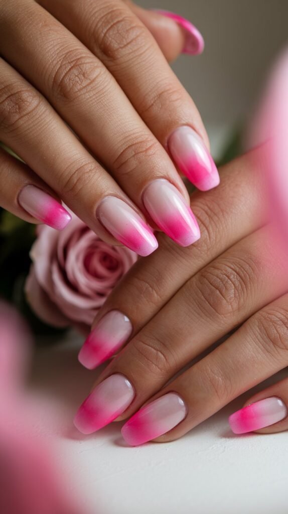 15 Simple Valentine’s Nail Designs for a Minimalist Look 8 a close up shot of hands with pink ombre nails the QOp9155UTceZVKSzraRglQ WKGbqj3tSnWY46hSm5v2og