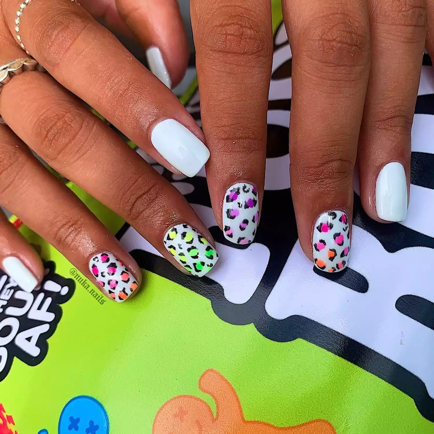 White nails with colorful leopard prints