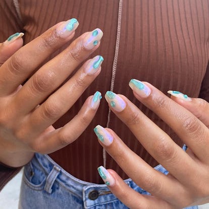 One summer coffin nail idea? Turquoise chrome nail art.