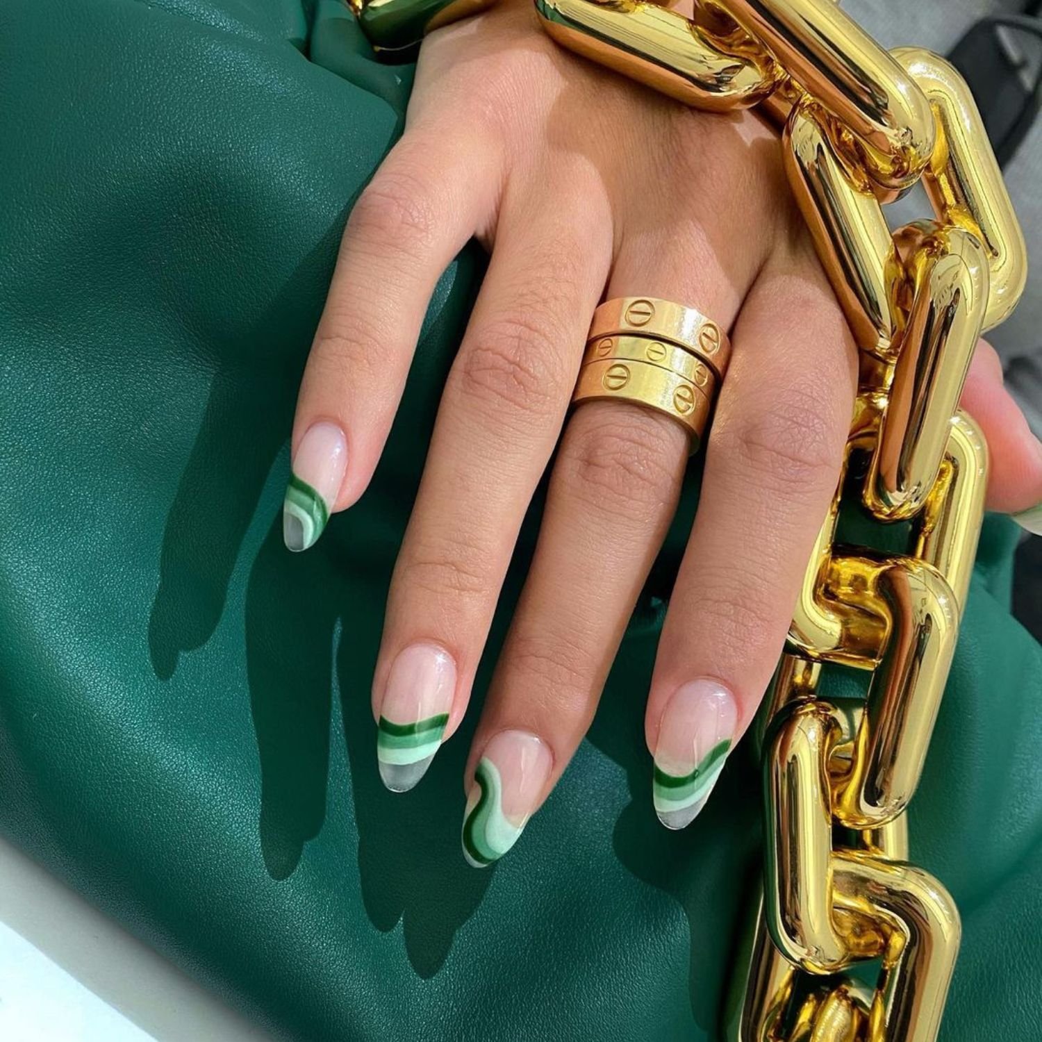 Abstract manicure with emerald green accents