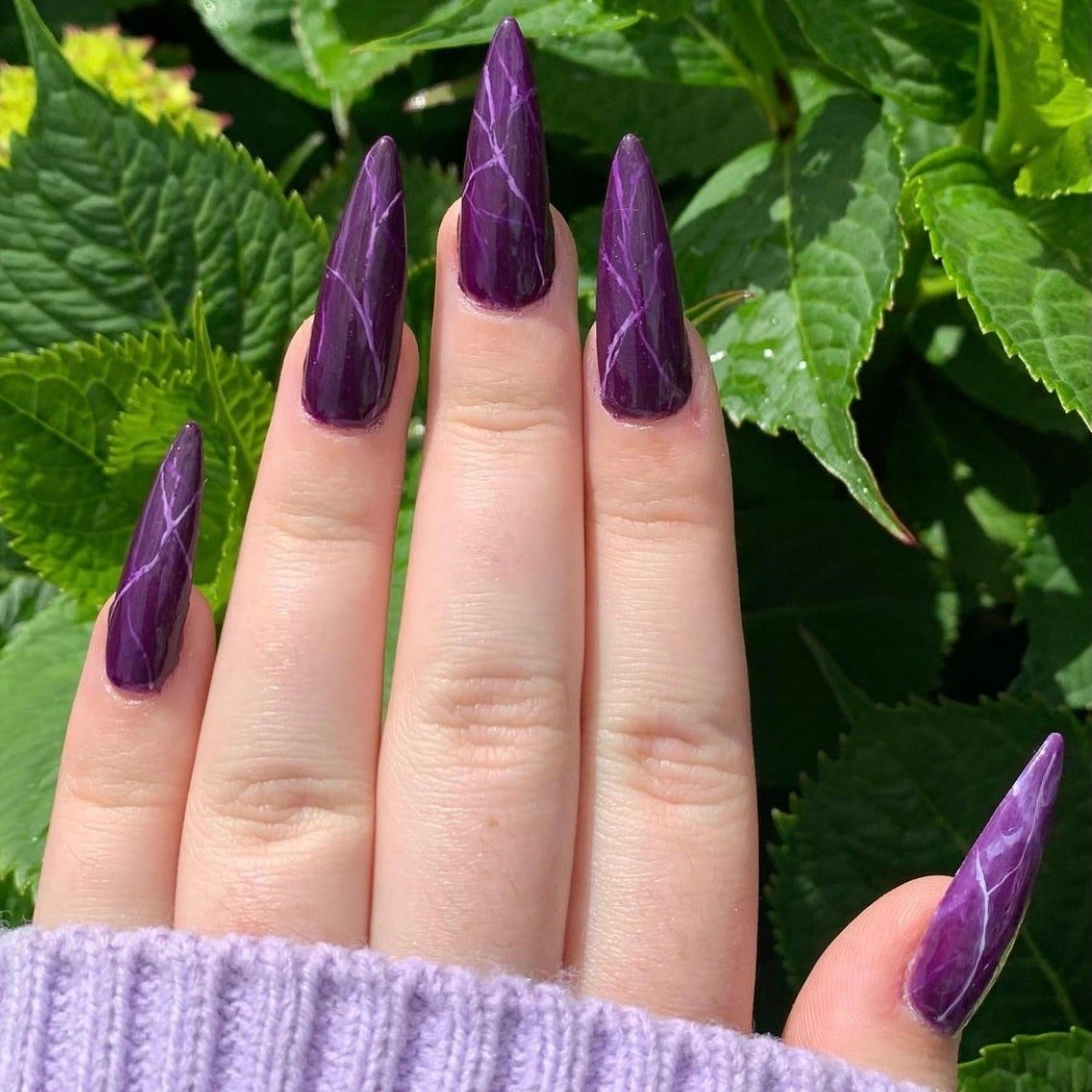 Pointy purple amethyst-inspired manicure